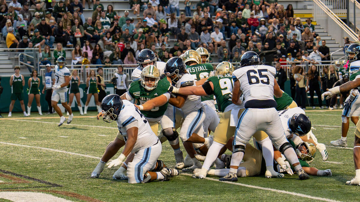 University of San Diego running back Omar Mbakwe finds the end zone against Cal Poly in the third quarter at Mustang Memorial Field on Sept. 19, 2026. The Mustangs lost to the Toreros 38-35 on Homecoming night on a last-minute field goal.